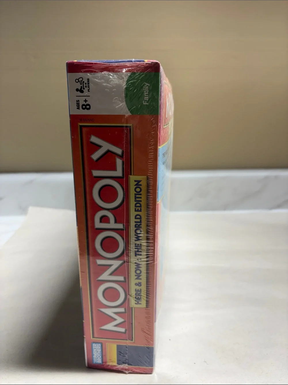 Monopoly Here & Now: The World Edition Board Game - Classic Red Box